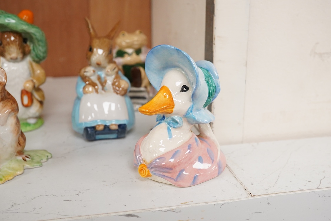 Twenty Beatrix Potter figures, mostly later production figures, largest 11cm high
